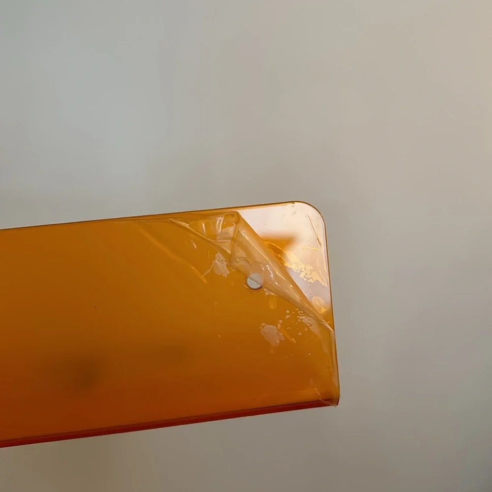• 2 orange acrylic shelves •